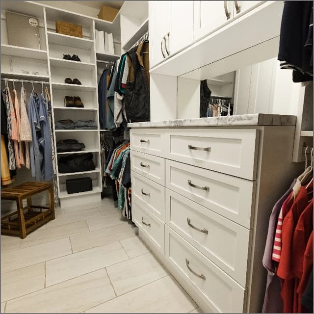 white counters with stainless steel appliances