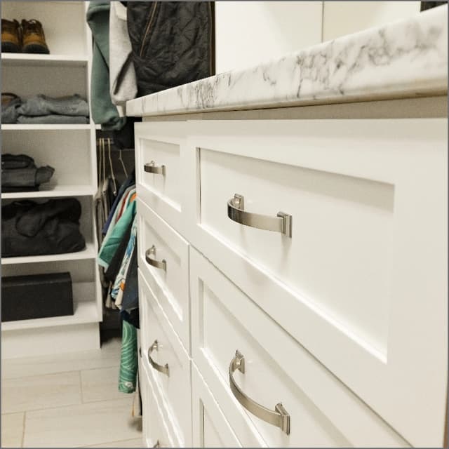 white counter with blue cabinets